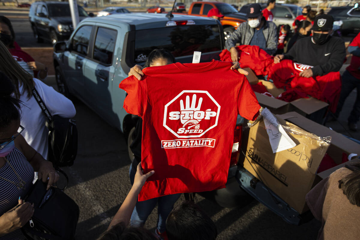 Shirts are sold before the start of a vehicle caravan in memory of the seven Zacarias family me ...