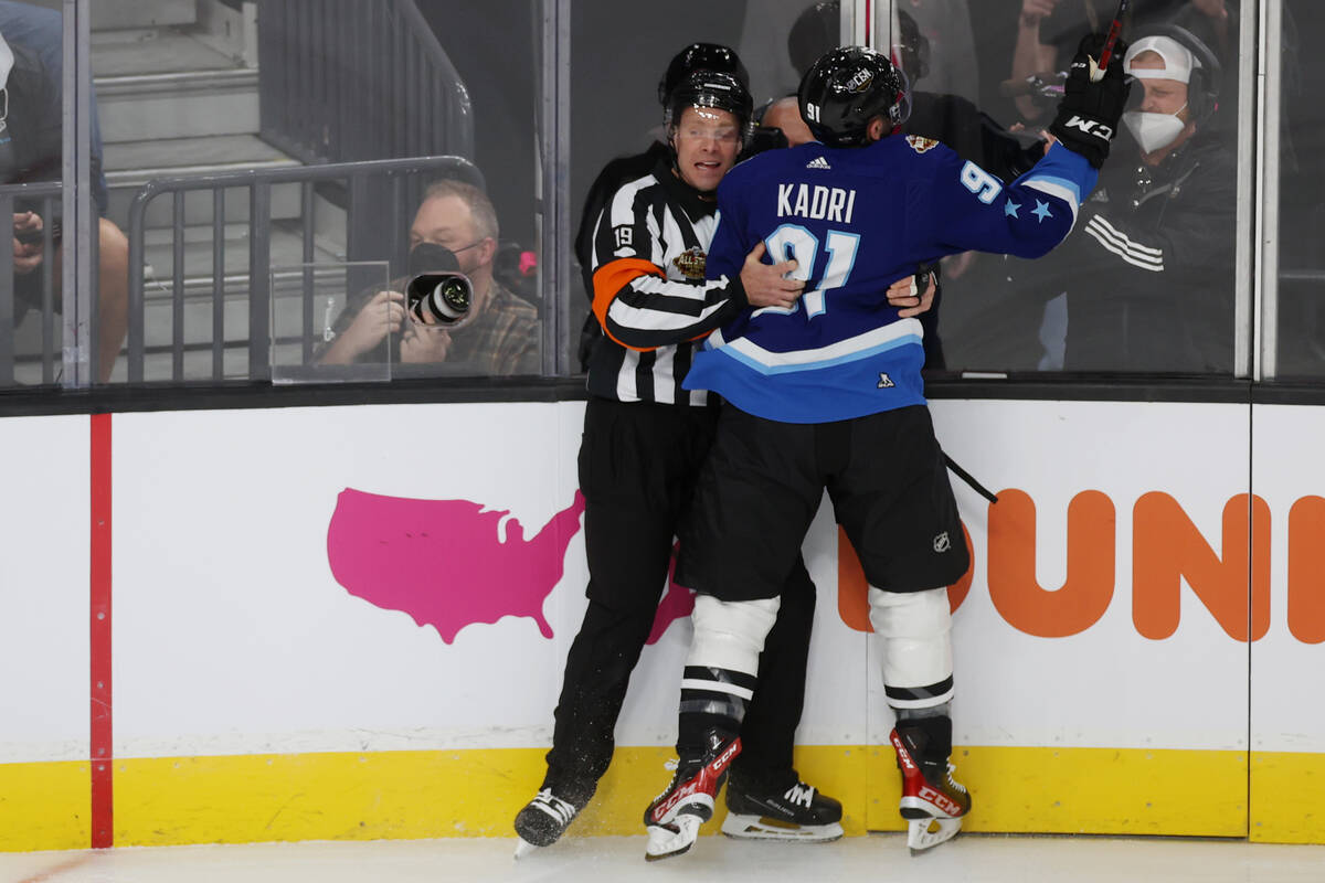 Colorado Avalanche forward Nazem Kadri (91) crashes into the referee after his score during the ...