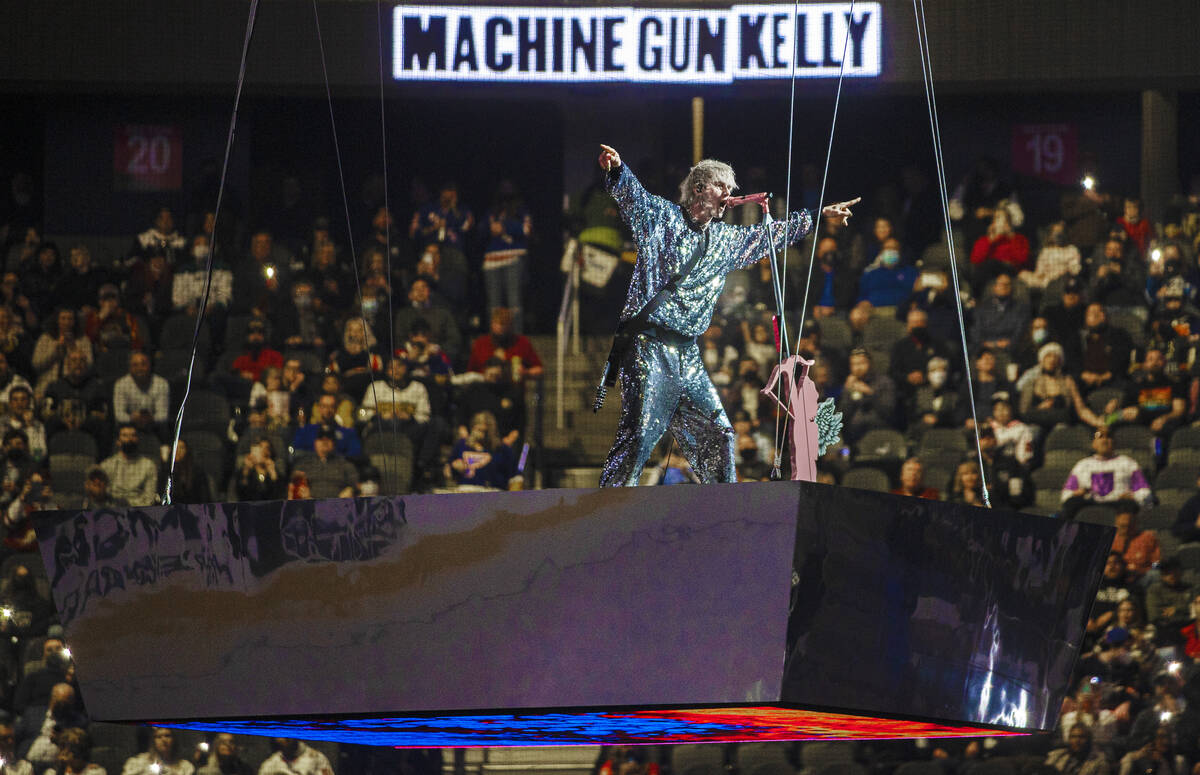 Machine Gun Kelly performs during the NHL All-Star Game on Saturday, Feb. 5, 2022, at T-Mobile ...