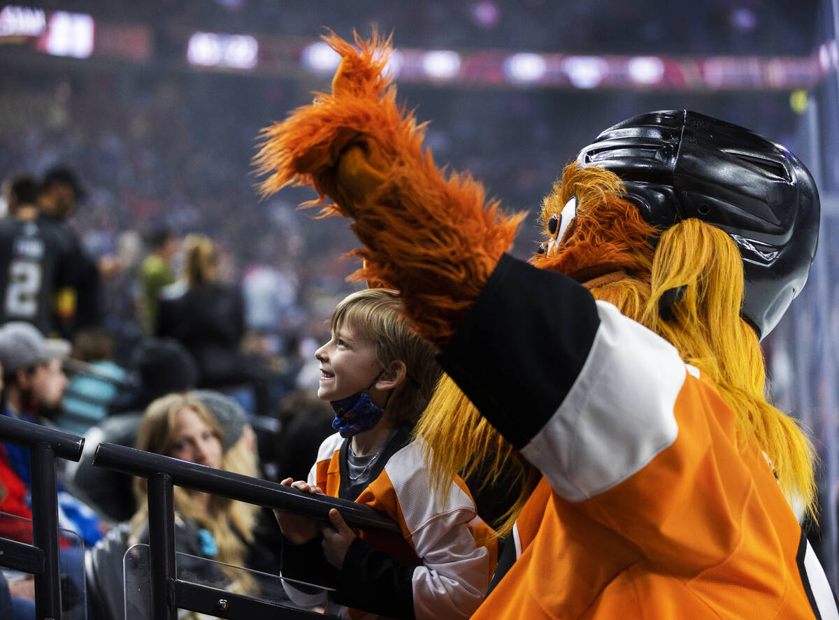 Philadelphia Flyers mascot Gritty takes photos with fans during the NHL All-Star Game on Saturd ...