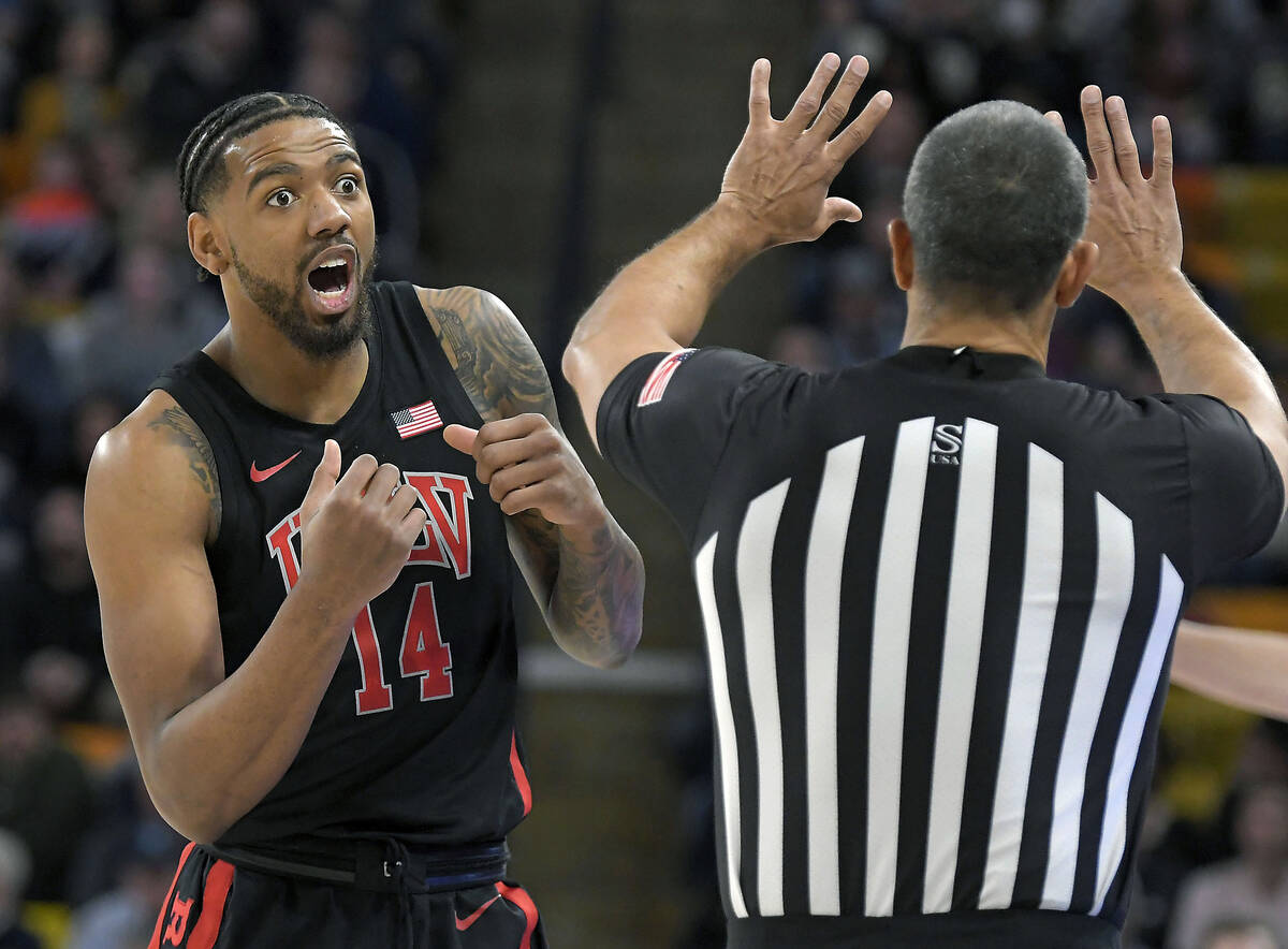 UNLV forward Royce Hamm Jr. (14) reacts after being called for a charge during the first half o ...
