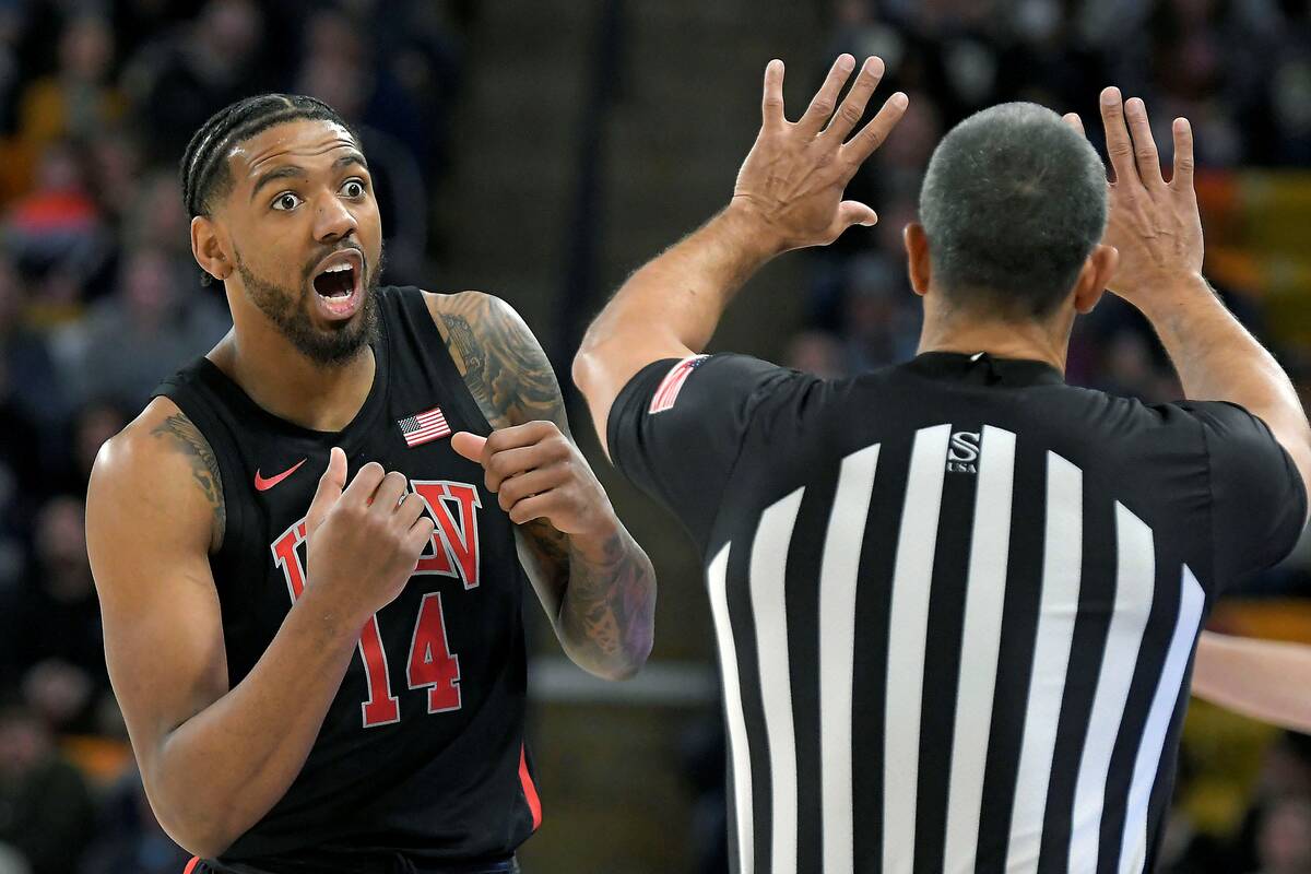 UNLV forward Royce Hamm Jr. (14) reacts after being called for a charge during the first half o ...