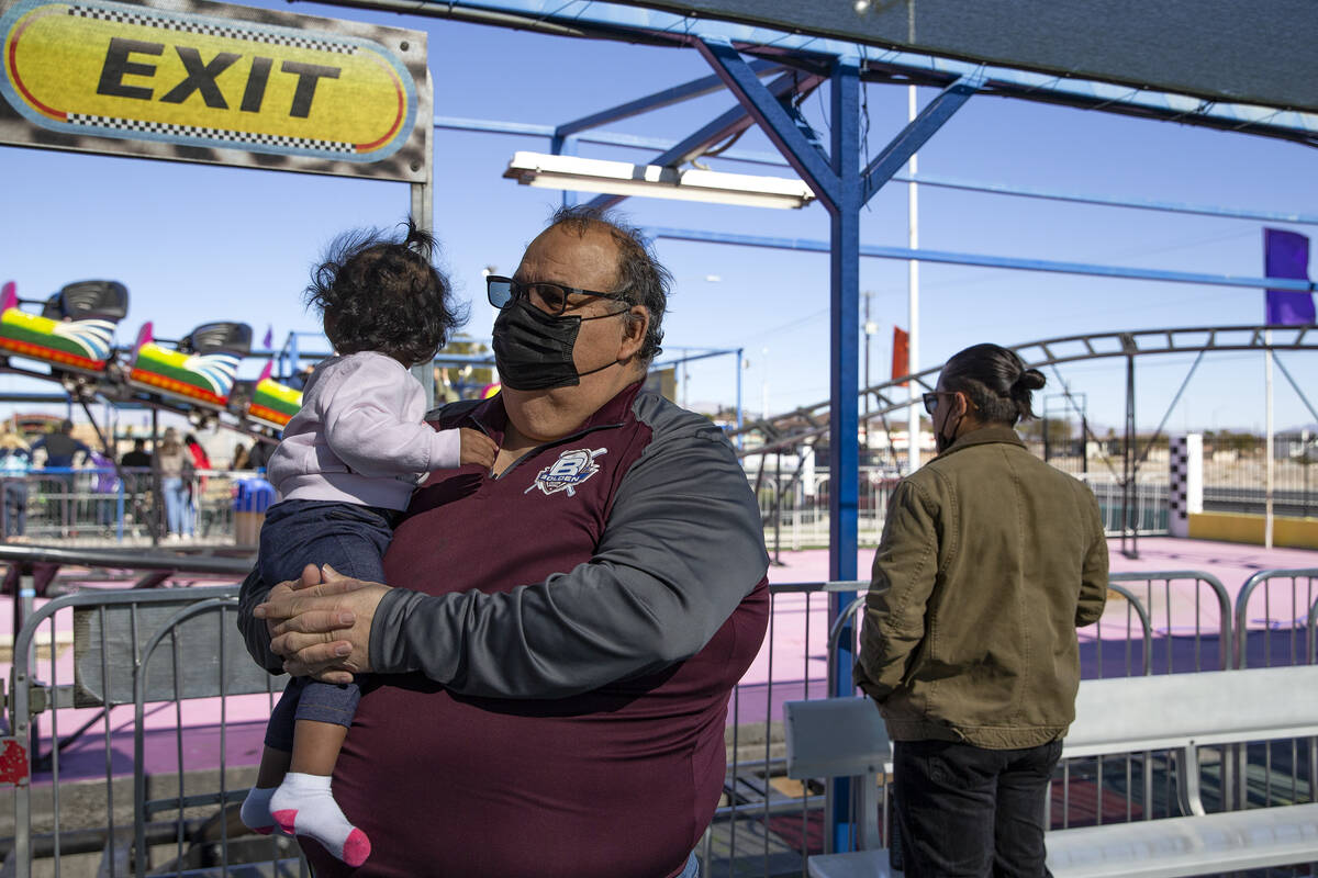 Mario Berlanga, owner of Mario’s Market in the Historic Westside, holds his granddaughter, Rh ...
