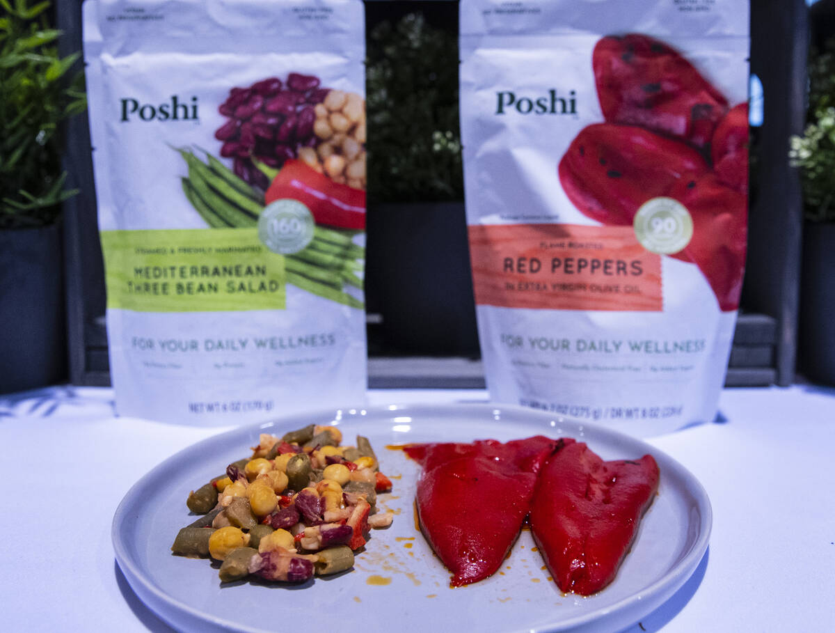 Mediterranean three been salad, left, and red peppers are at Poshi booth during the Fancy Food ...