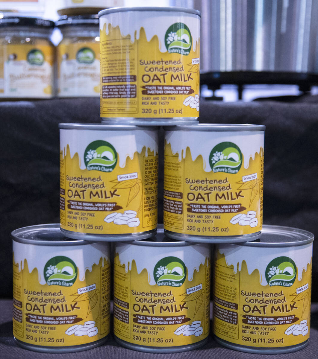Cans of sweetened condensed oat milk by Nature's Charm are displayed during the Fancy Food Show ...
