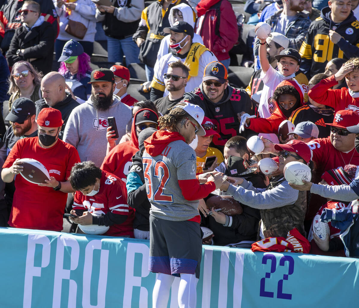 Kansas City Chiefs Tyrann Mathieu (32) signs autographs for fans during the AFC Pro Bowl player ...