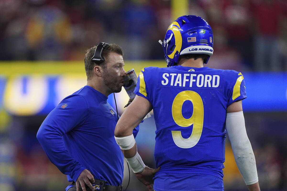 Los Angeles Rams head coach Sean McVay talks with quarterback Matthew Stafford (9) against the ...