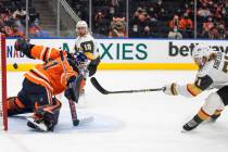 Vegas Golden Knights' William Karlsson (71) scores on Edmonton Oilers goalie Mike Smith (41) du ...