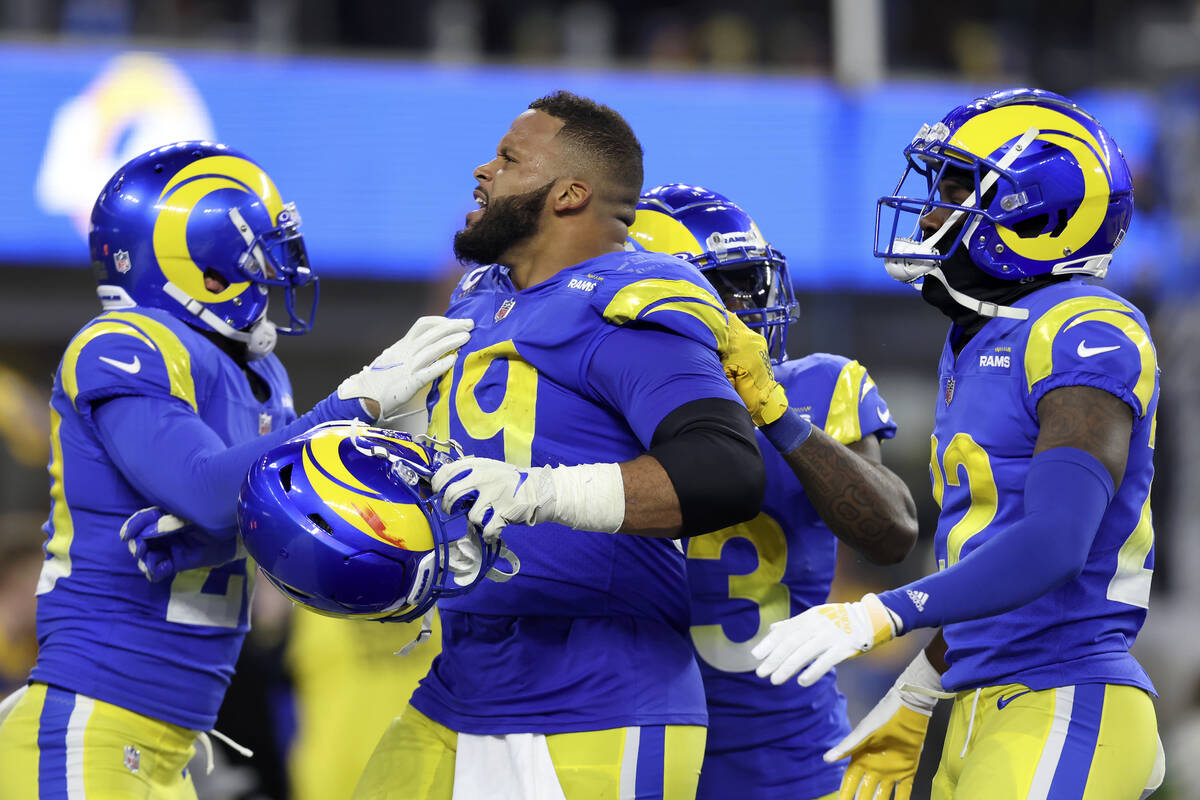 Los Angeles Rams defensive end Aaron Donald, middle, celebrates with teammates during the secon ...