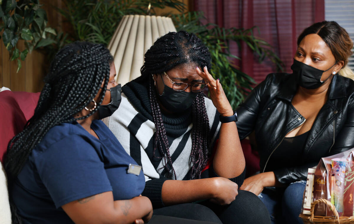 Jessica Stingley, from left, LaShonda Warfield and LaTory Houston react as they talk about Tana ...