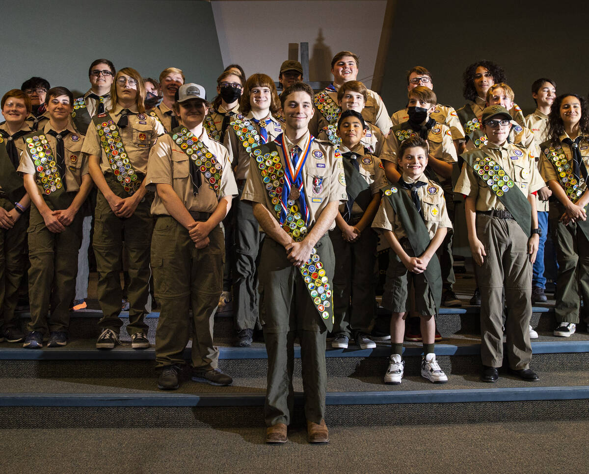 Cash Karlen, of Boy Scout Troop 912, center, poses for a portrait with fellow scouts before bei ...