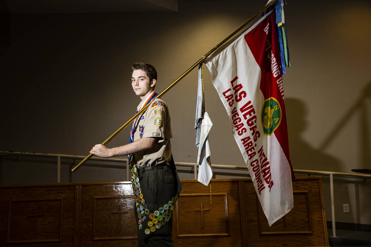 Cash Karlen, of Boy Scout Troop 912, poses for a portrait before being recognized for earning a ...