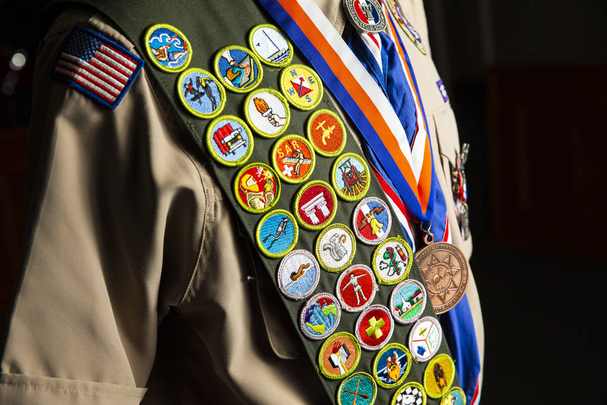 Cash Karlen, of Boy Scout Troop 912, poses for a portrait before being recognized for earning a ...