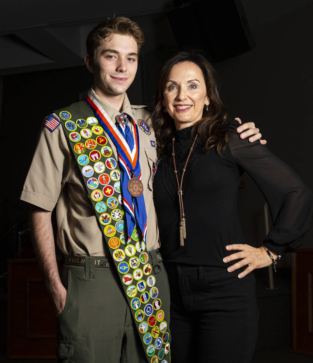 Cash Karlen, of Boy Scout Troop 912, poses for a portrait with his mom, Stacey Tyler, before be ...