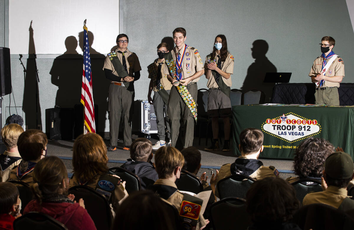 Cash Karlen, of Boy Scout Troop 912, center, is recognized for earning all 138 merit badges in ...