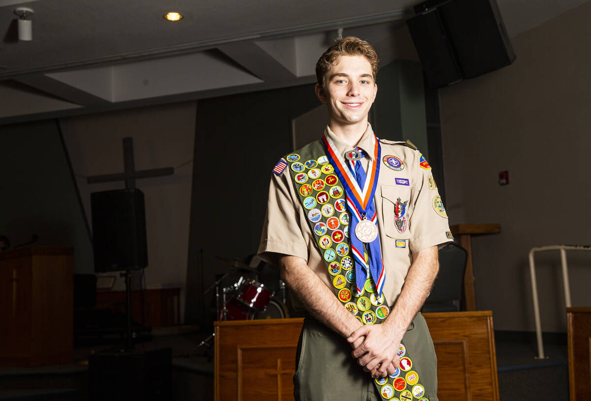 Cash Karlen, of Boy Scout Troop 912, poses for a portrait before being recognized for earning a ...