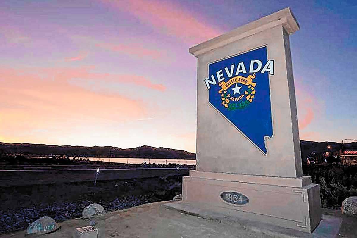 A "Welcome to Nevada" monument sign similar to the one shown along U.S. Highway 395 at the Cali ...