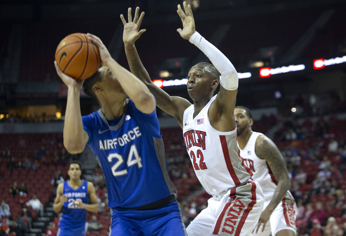 UNLV Rebels guard Josh Baker (22) defends against Air Force Falcons guard Jeffrey Mills (24) du ...