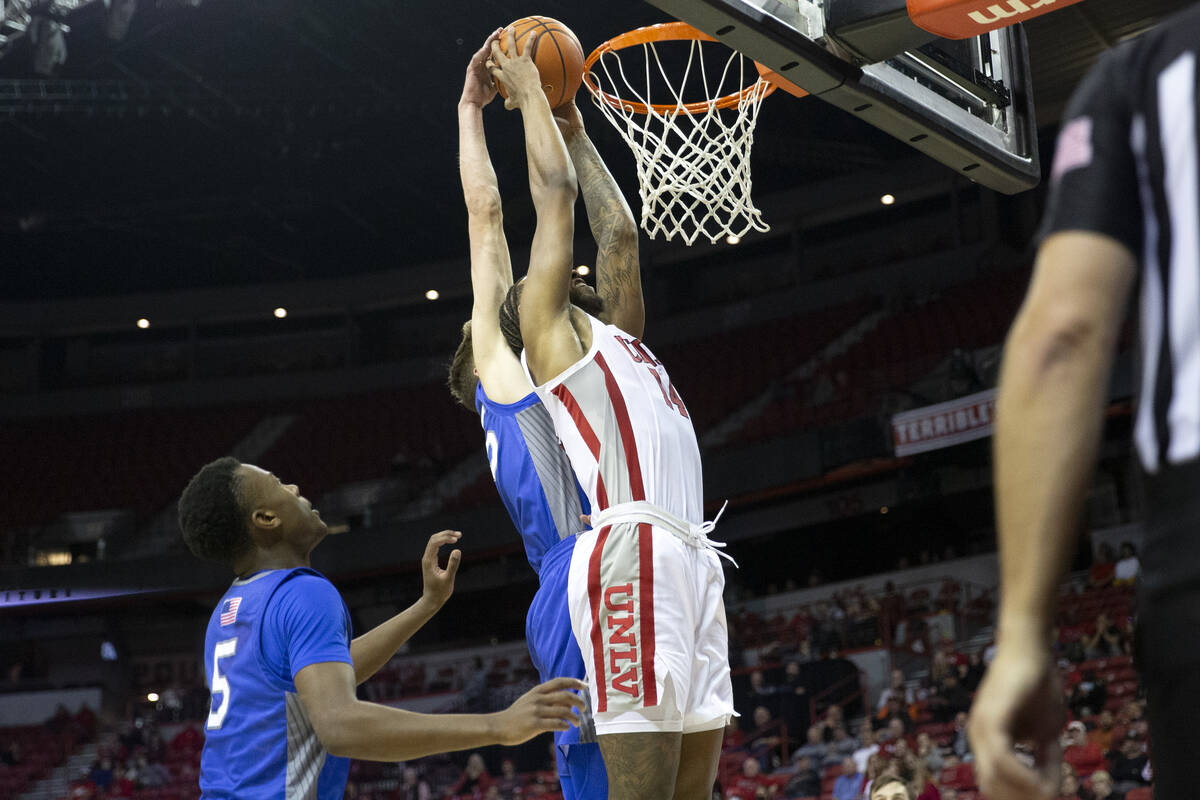 UNLV Rebels forward Royce Hamm Jr. (14) shoots against Air Force Falcons center Lucas Moerman ( ...