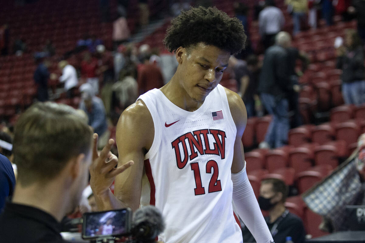 UNLV Rebels center David Muoka (12) celebrates to the camera after winning an NCAA college bask ...
