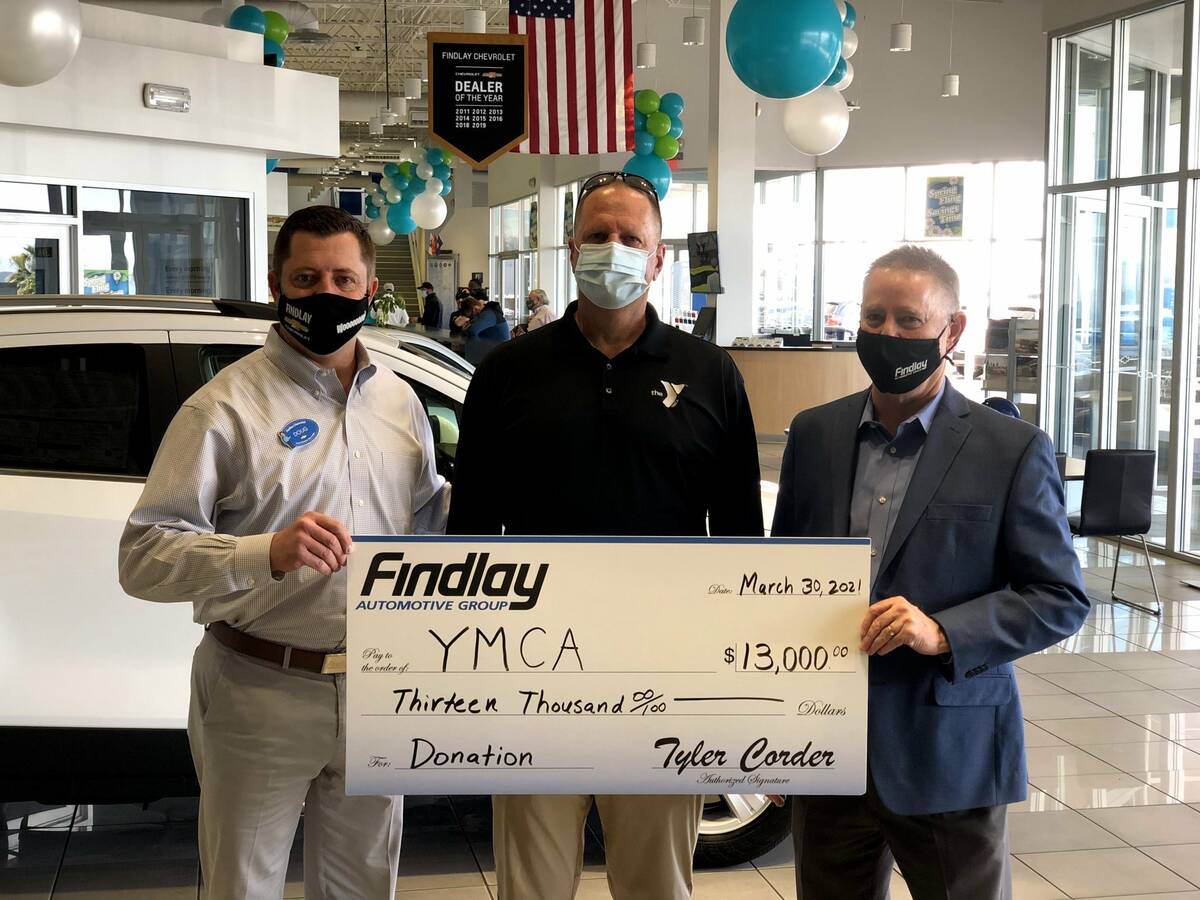 Doug Fleming, left, general manager of Findlay Chevrolet, and Tyler Corder, right, CFO Findlay ...
