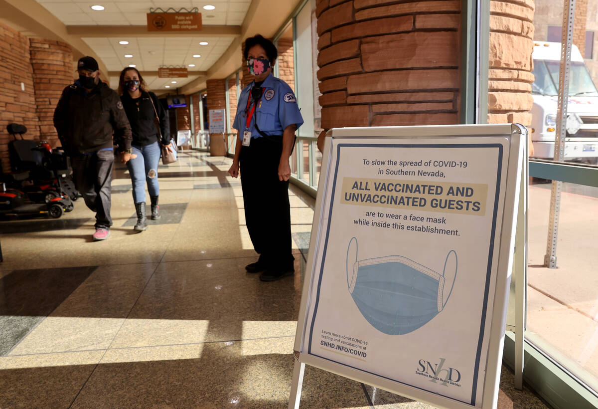 Signs remain at the Clark County Government Center following Gov. Steve Sisolak’s announ ...