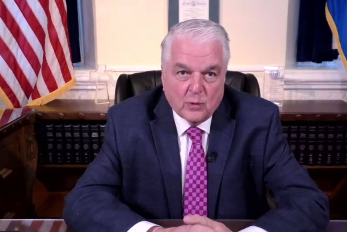 This screenshot shows Nevada Gov. Steve Sisolak during a virtual press conference, Thursday, Fe ...