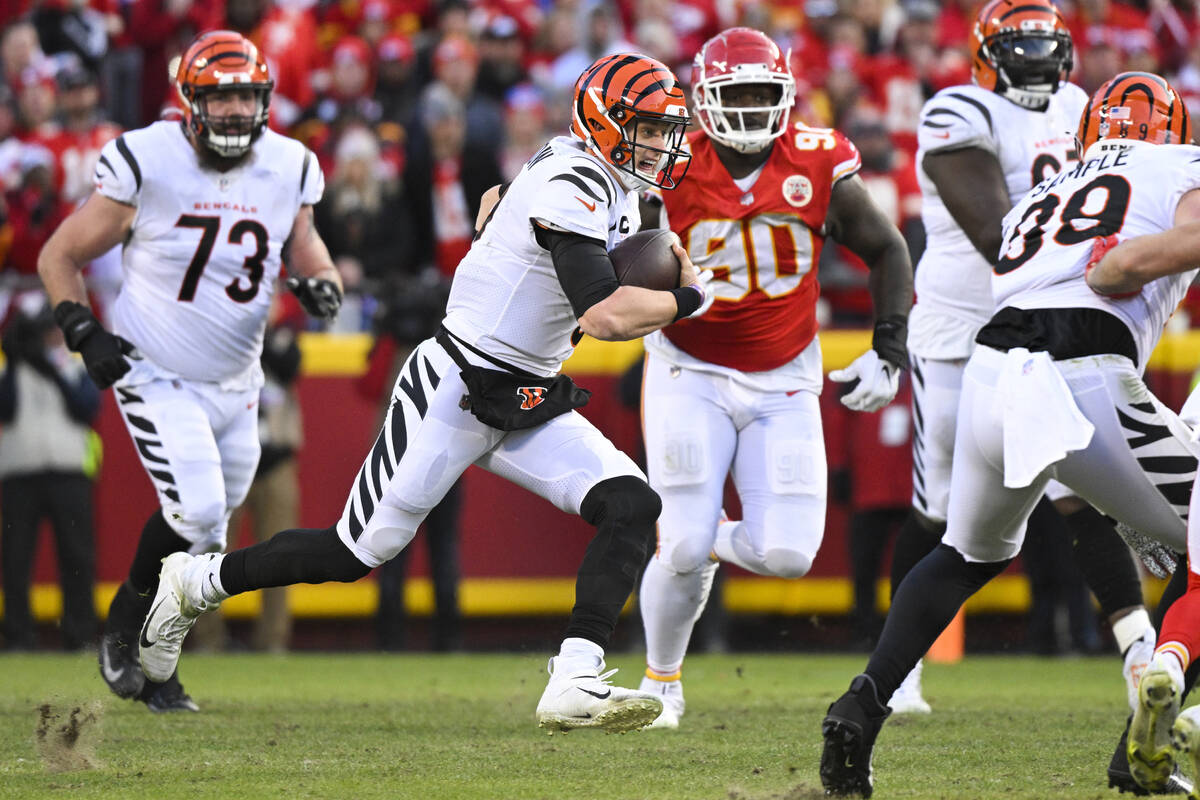 Cincinnati Bengals quarterback Joe Burrow runs for yardage against the Kansas City Chiefs durin ...