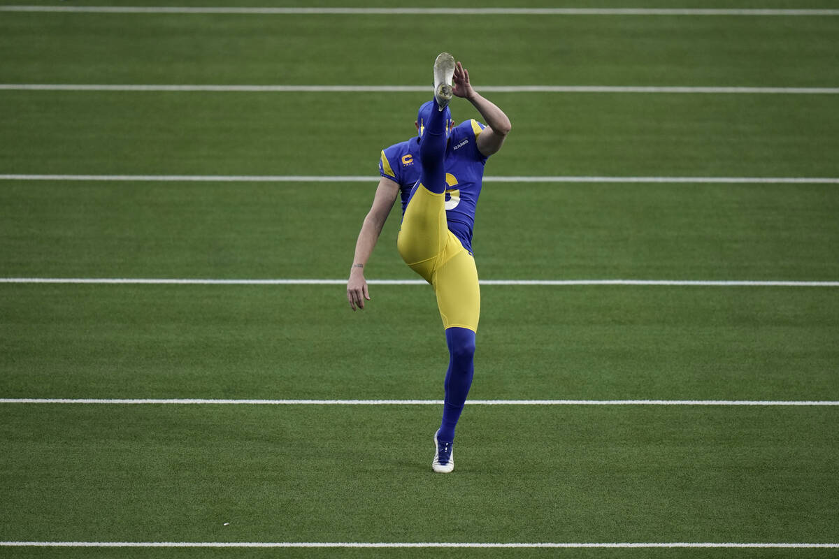 Los Angeles Rams punter Johnny Hekker warms up before an NFL wild-card playoff football game ag ...
