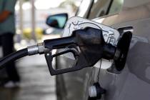 Fuel is pumped into a vehicle, Thursday, June 14, 2012, in Miami. (AP Photo/Lynne Sladky)