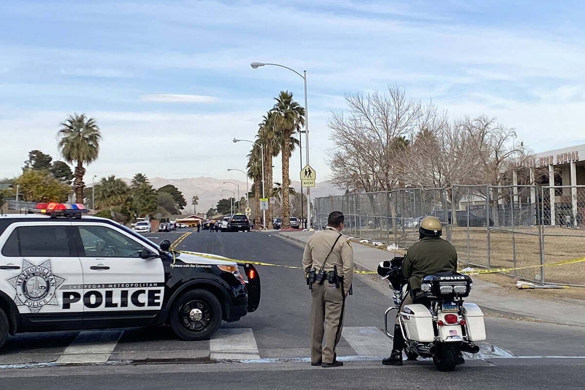 Las Vegas police cordon off a shooting scene immediately adjacent to Chapparal High School on M ...