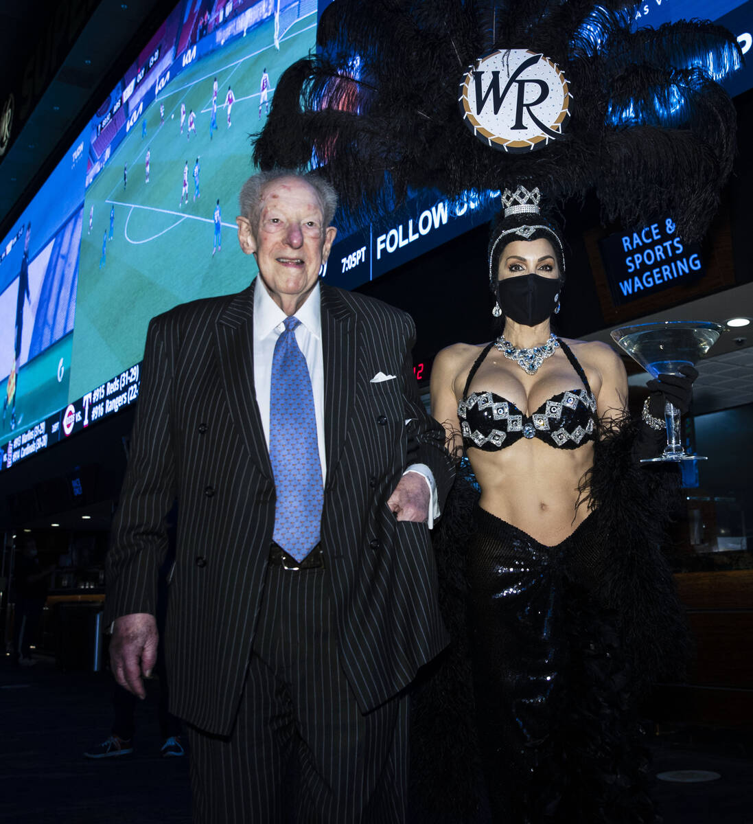 Former Las Vegas Mayor Oscar Goodman leaves Westgate Superbook with showgirl Jennifer Gagliano ...