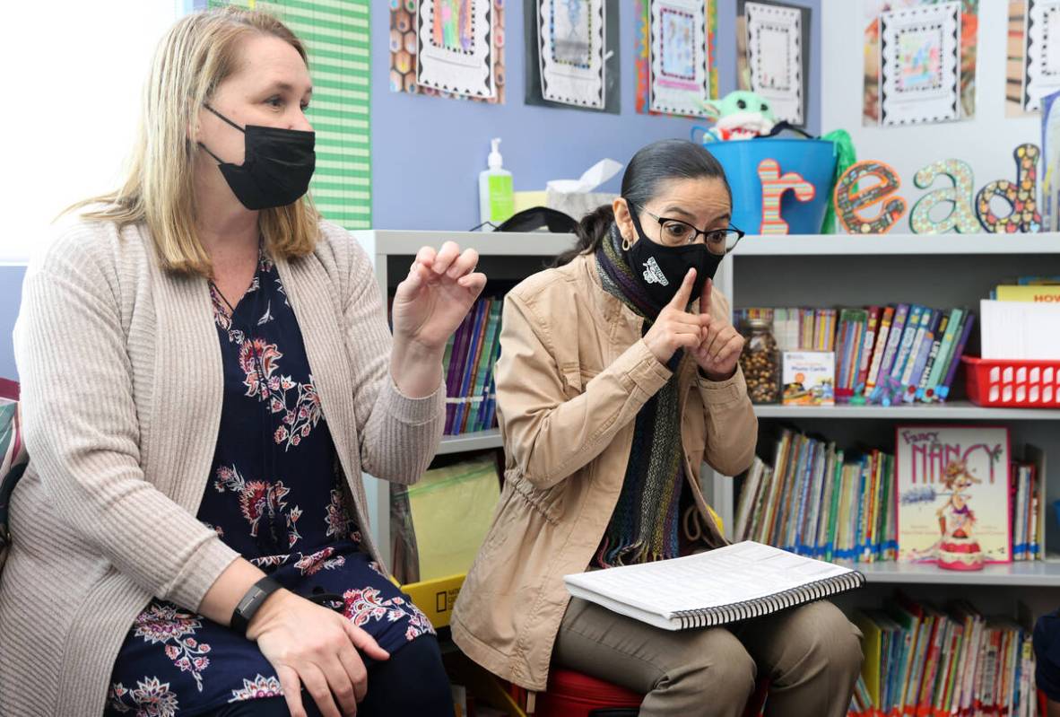 Student teacher Maria Romero, right, works with first graders under the guidance of teacher Bri ...