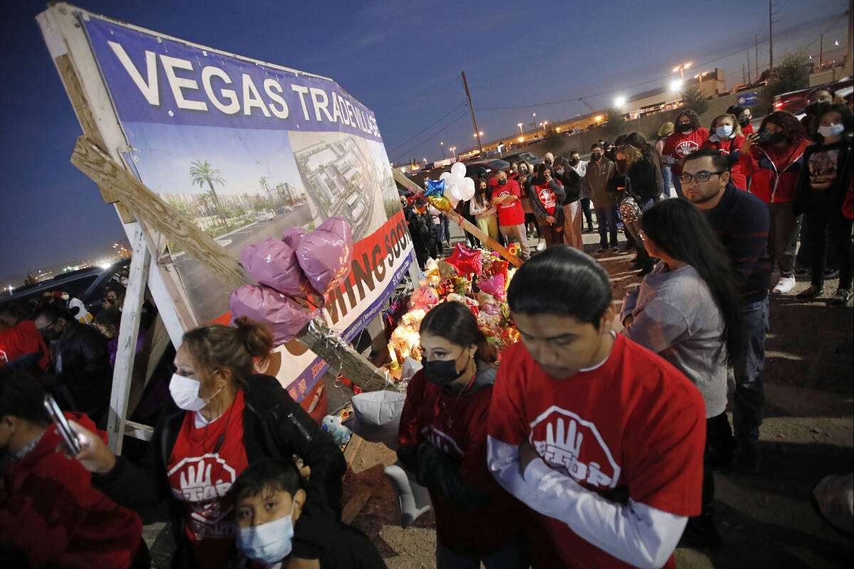 People gather for a vigil, Saturday, Feb. 5, 2022, in honor of the victims of a six-vehicle cr ...