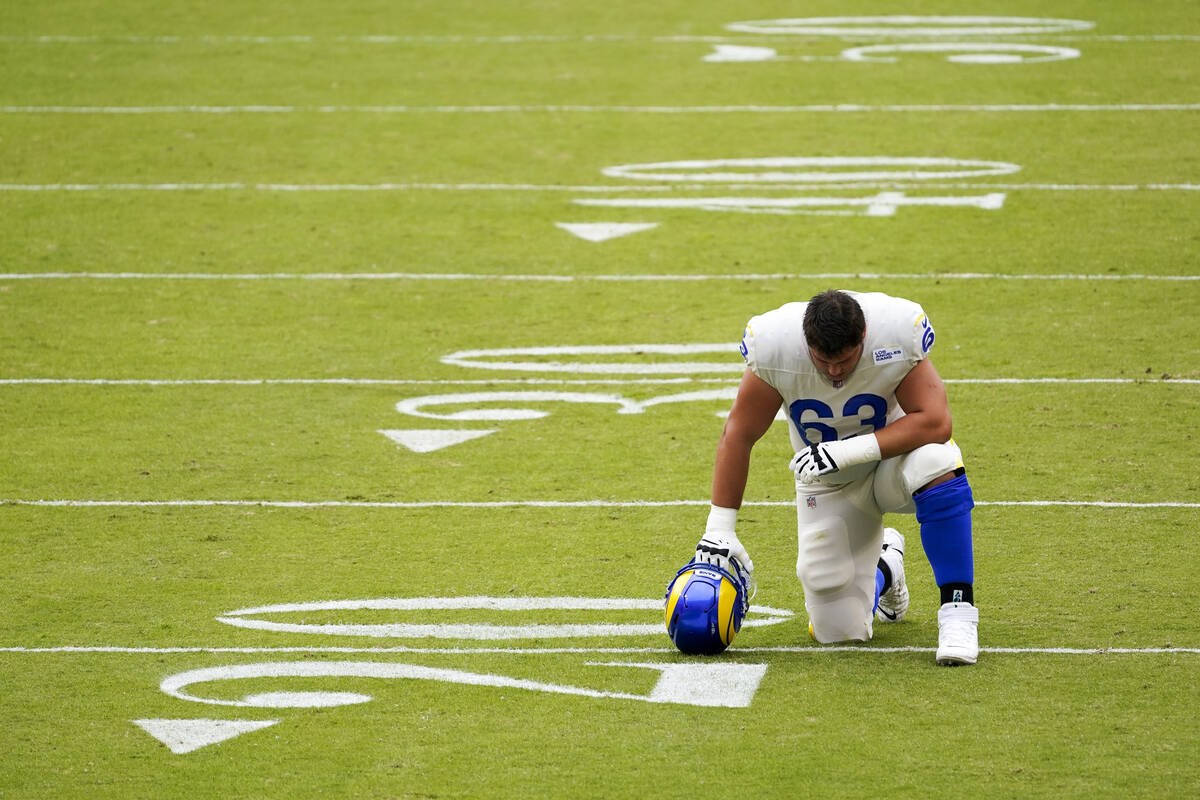 Los Angeles Rams' Austin Corbett pauses before an NFL football game against the Washington Foot ...