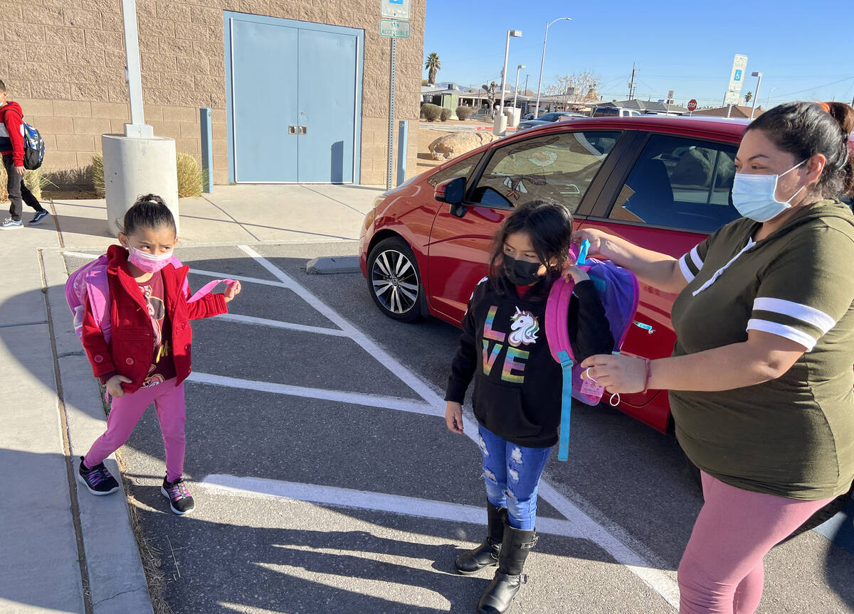 Julia Alvarado drops off her daughters Liliana, 6, and Jennifer, 8, at Wendell Williams Element ...
