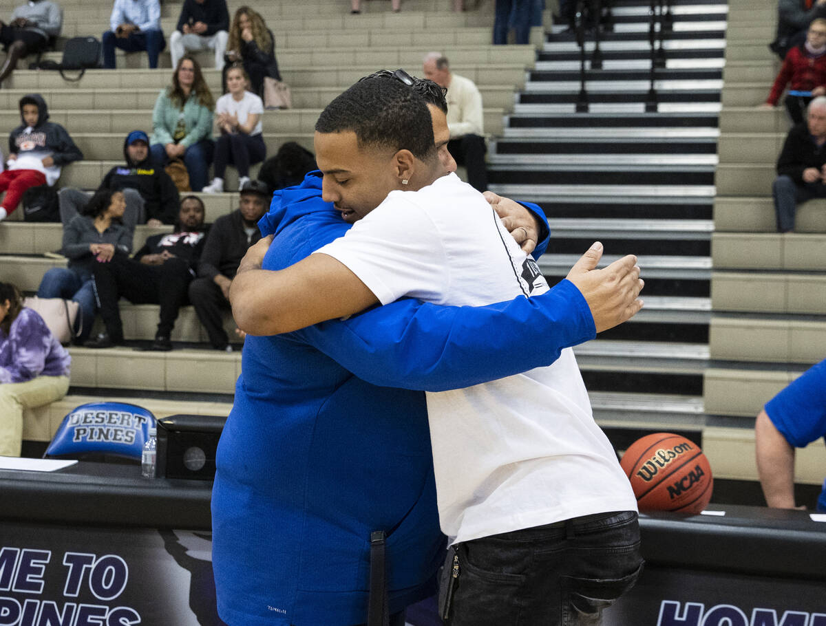 Cleveland Browns linebacker Tony Fields ll, right, a 2016 graduate of Desert Pines, hugs his fo ...