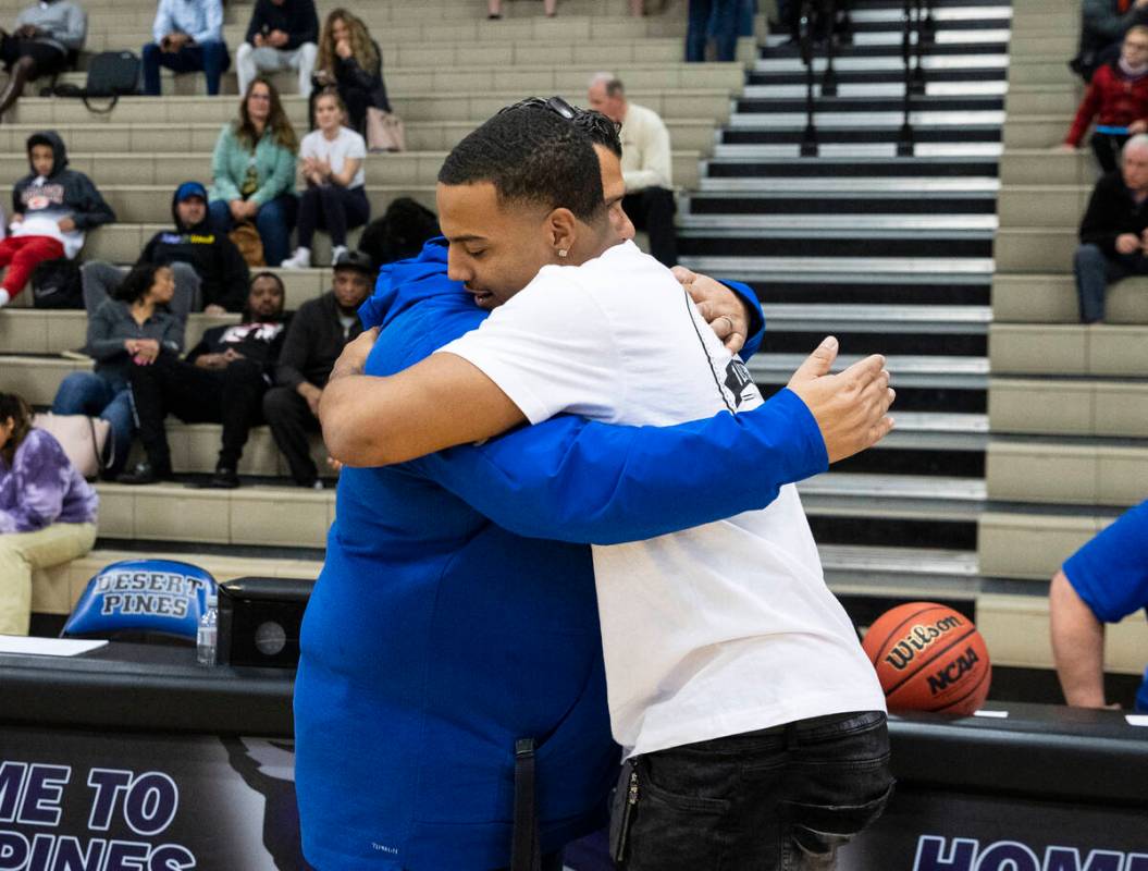 Cleveland Browns linebacker Tony Fields ll, right, a 2016 graduate of Desert Pines, hugs his fo ...