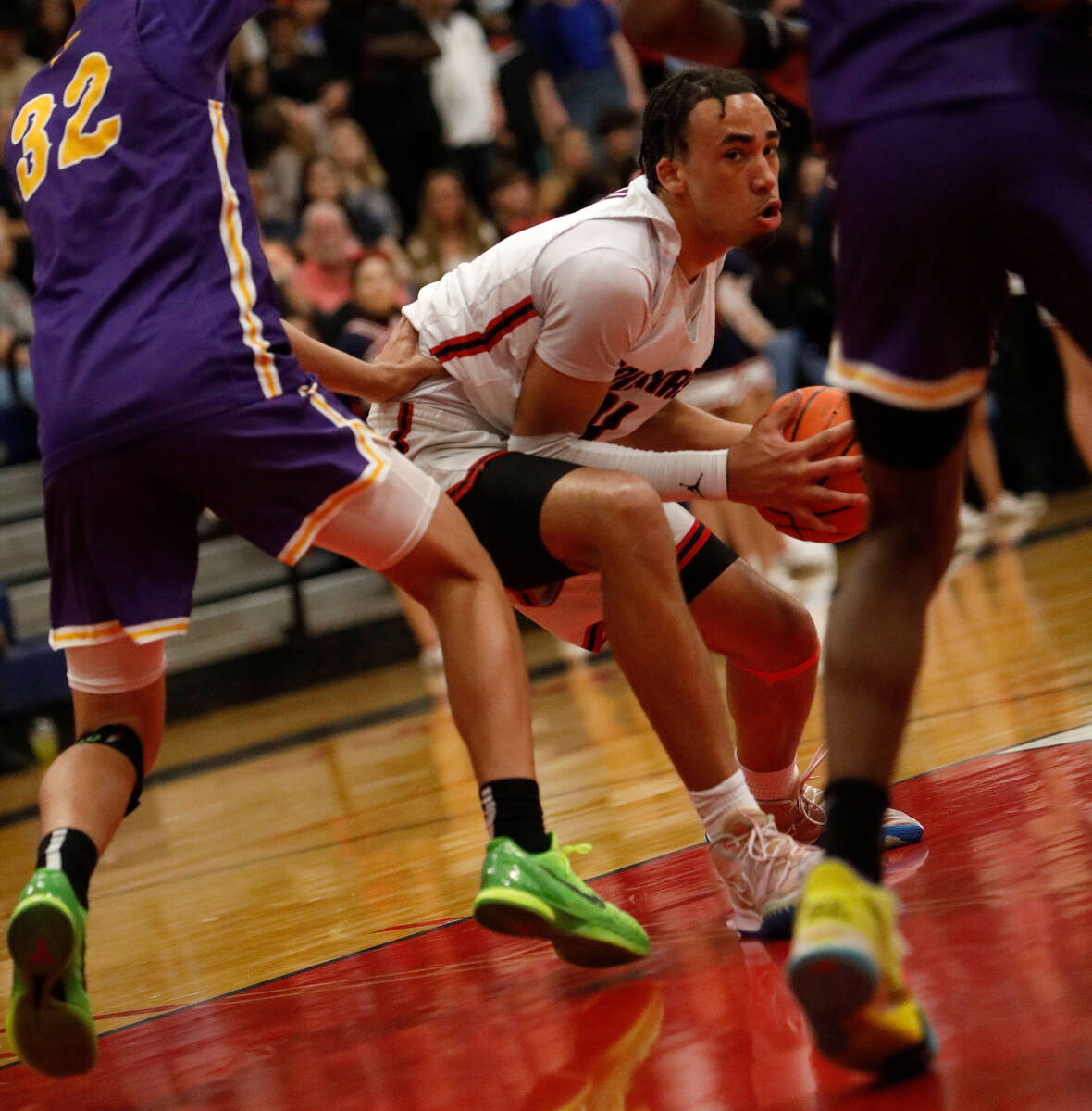 Coronado High School's Osiris Grady (11) keeps a ball away from Durango High School players dur ...