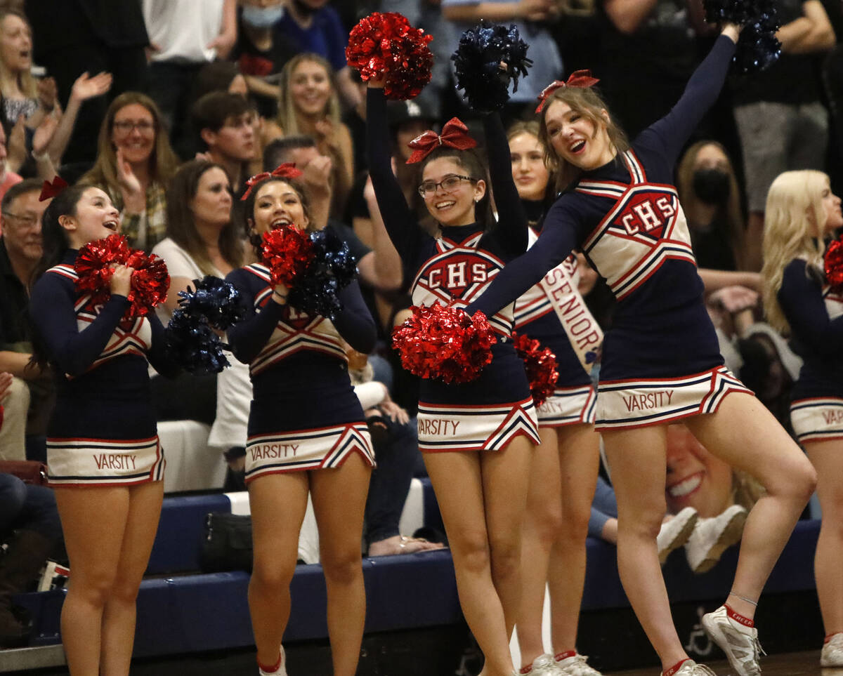 Coronado High School cheerleaders cheer during the second half of a basketball game at Coronado ...