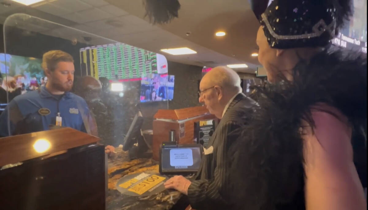 Oscar Goodman attempts to make his annual Super Bowl bet with Andrew Dupont, as Showgirl Kristi ...