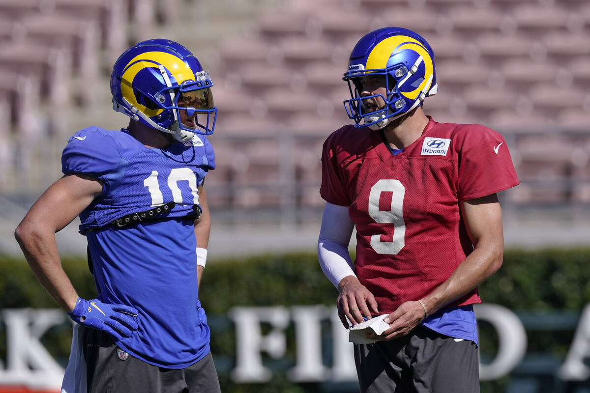 Los Angeles Rams wide receiver Cooper Kupp, left, talks with quarterback Matthew Stafford durin ...