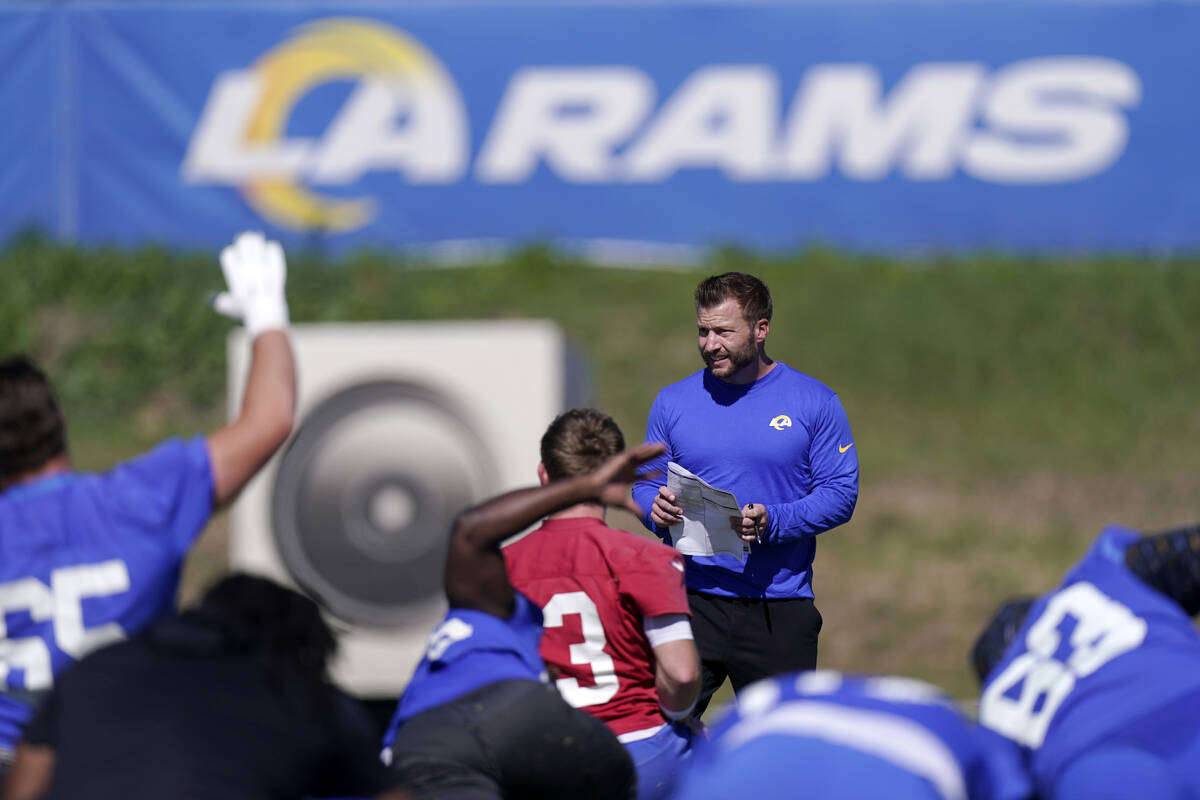 Los Angeles Rams head coach Sean McVay watches as his team stretches during practice for an NFL ...