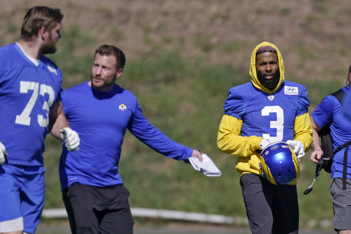 Los Angeles Rams head coach Sean McVay, center, talks to guard David Edwards, left, as wide rec ...