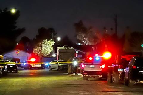 Las Vegas Metropolitan Police Department officers at a homicide investigation on the 6200 block ...