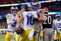 Los Angeles Rams wide receiver Cooper Kupp (10) is congratulated by teammates after scoring a t ...