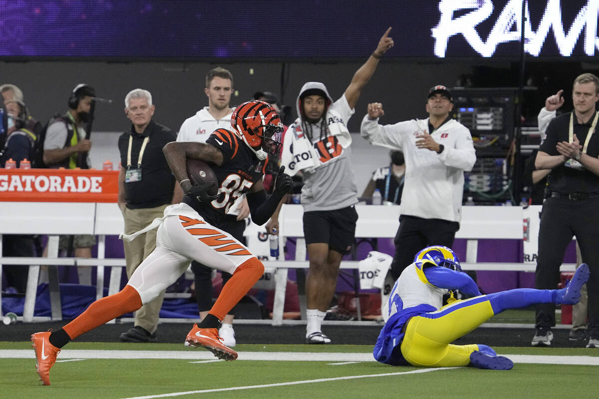 Cincinnati Bengals wide receiver Tee Higgins, left, runs past Los Angeles Rams cornerback Jalen ...