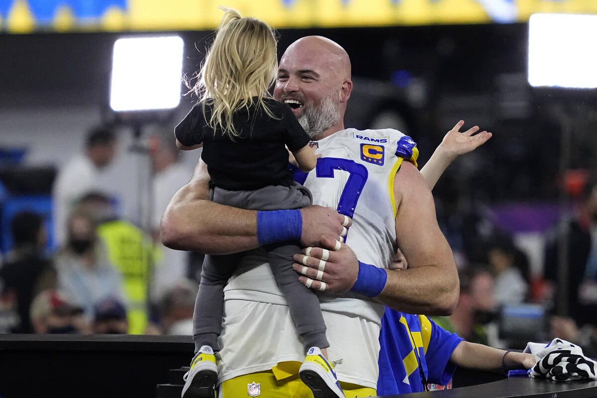 Los Angeles Rams offensive tackle Andrew Whitworth (77) hold his daughter after the NFL Super B ...