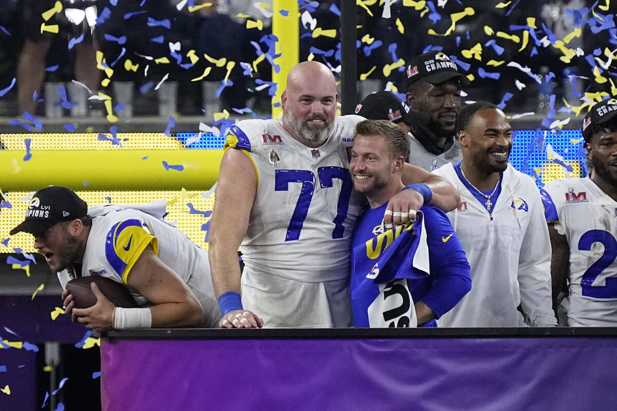 Los Angeles Rams head coach Sean McVay hugs offensive tackle Andrew Whitworth (77) after the NF ...