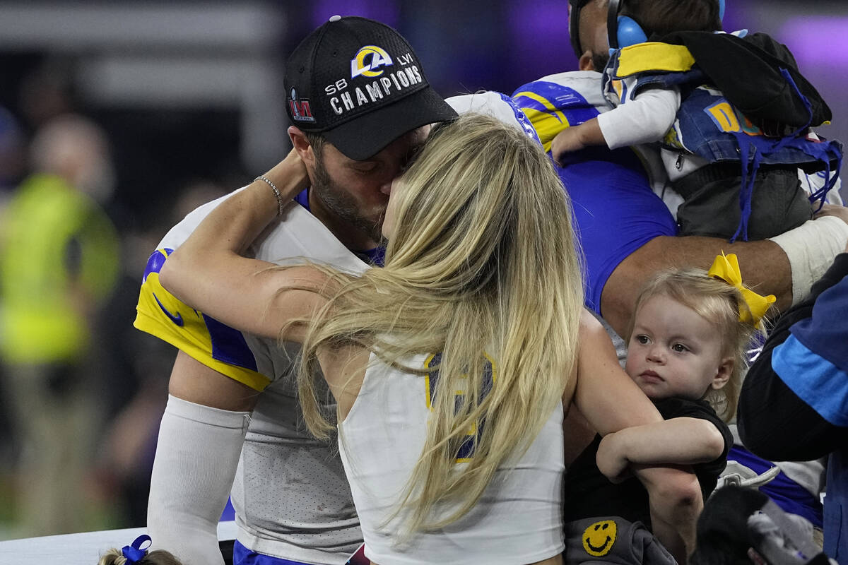 Los Angeles Rams quarterback Matthew Stafford kisses his wife Kelly Hall  after the NFL Super Bo …